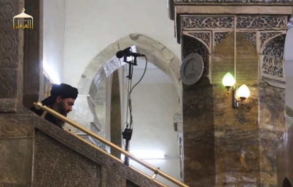 'Islamic State of Iraq and Syria' leader Abu Bakr al-Baghdadi descends from the pulpit of Mosul's al-Nuri mosque after announcing the creation of a 'caliphate' in this screen shot from a June 2104 video.