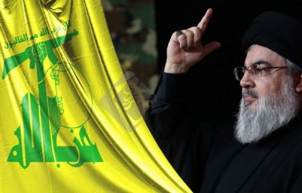 Hizbullah chief Hassan Nasrallah is seen with the party's flag in a photo circulated online.