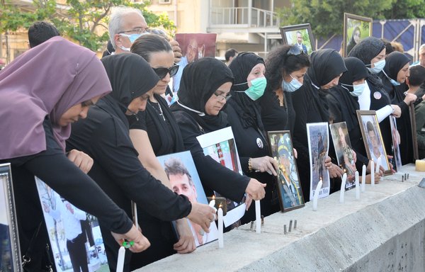 Families of the victims of the August 4, 2020 Beirut port blast light candles during a July 4 vigil. [Ziad Hatem]
