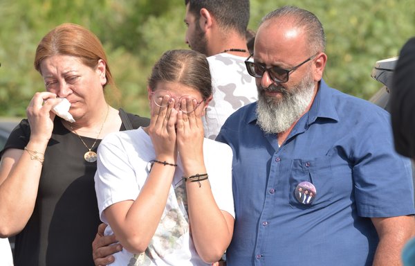 Relatives of three firefighters from the same family who lost their lives in the Beirut port blast mourn the loss of their loved ones. [Ziad Hatem]