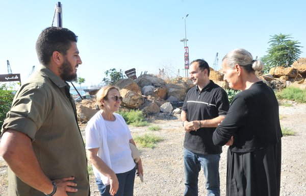 At Beirut port, Hayat Abu Chakra (right), Pierre Gemayel and William Noun (left) discuss the investigation into the August 4, 2020, explosion that killed their loved ones. [Ziad Hatem/Al-Mashareq]